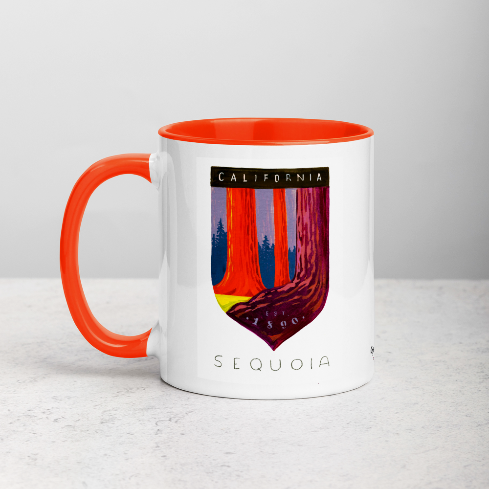 White ceramic coffee mug with orange handle and inside; has Sequoia National Park illustration by Angela Staehling
