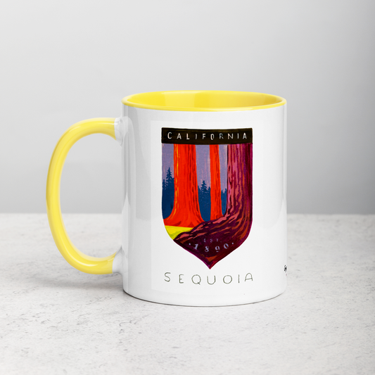 White ceramic coffee mug with yellow handle and inside; has Sequoia National Park illustration by Angela Staehling