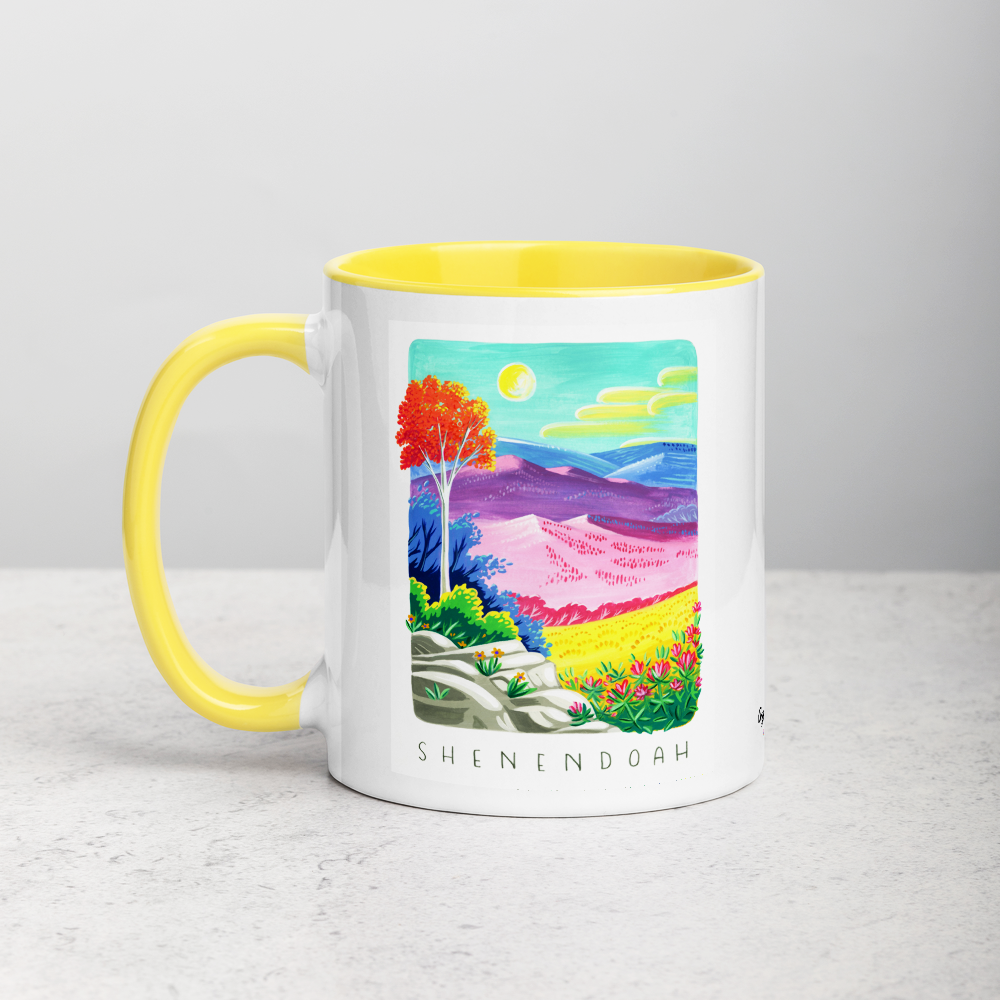 White ceramic coffee mug with yellow handle and inside; has Shenandoah National Park illustration by Angela Staehling