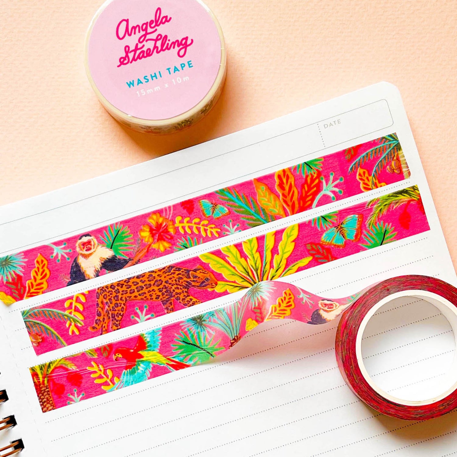 Tropical hibiscus washi tape rolled out across paper