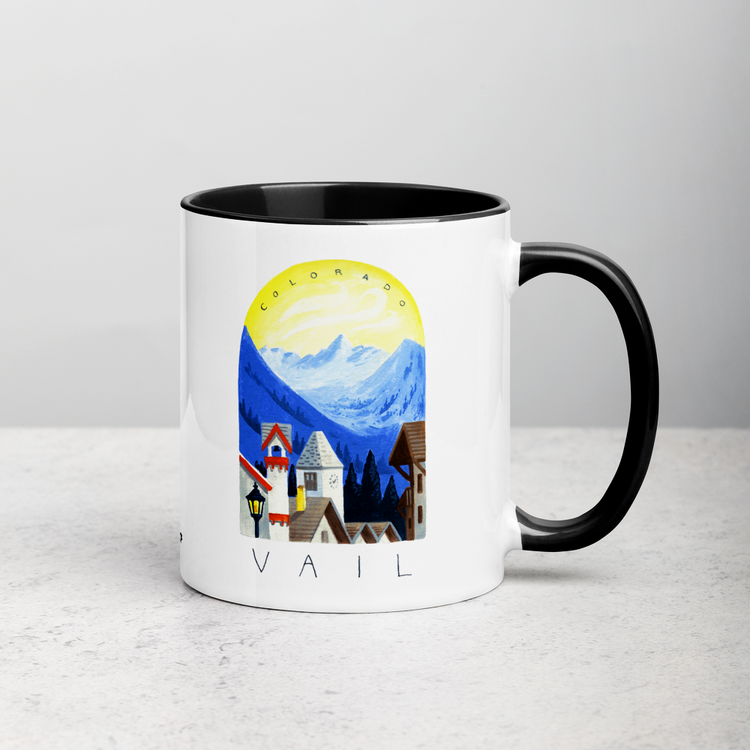 White ceramic coffee mug with black handle and inside; has Sonoma Vail Colorado illustration by Angela Staehling