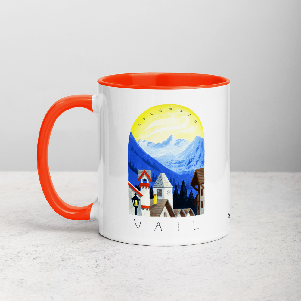 White ceramic coffee mug with orange handle and inside; has Sonoma Vail Colorado illustration by Angela Staehling
