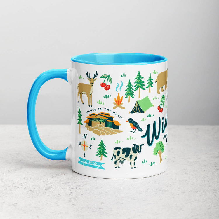 White ceramic coffee mug with blue handle and inside; has Wisconsin illustration by Angela Staehling