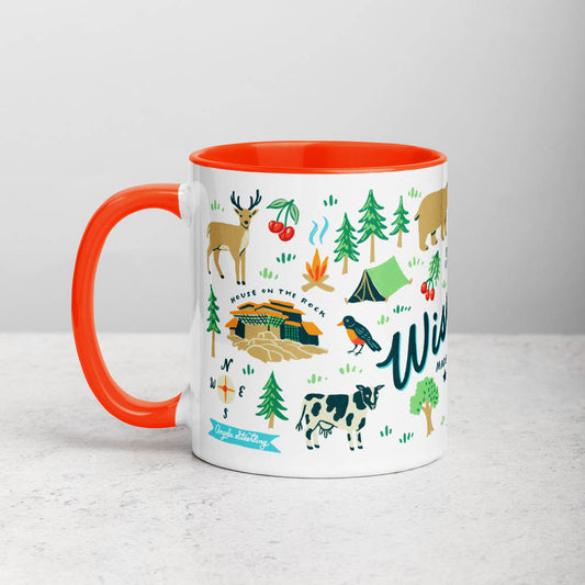 White ceramic coffee mug with orange handle and inside; has Wisconsin illustration by Angela Staehling