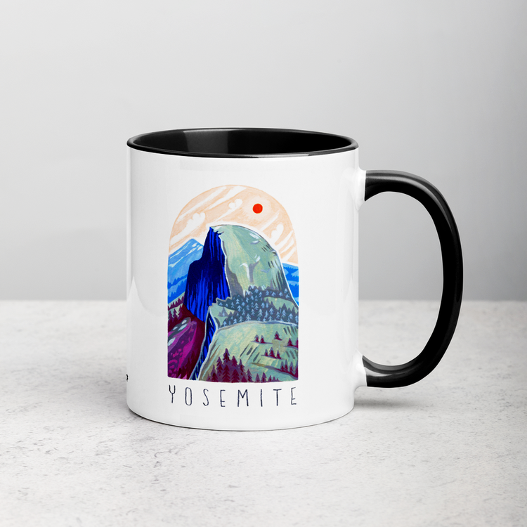 White ceramic coffee mug with black handle and inside; has Yosemite National Park illustration by Angela Staehling