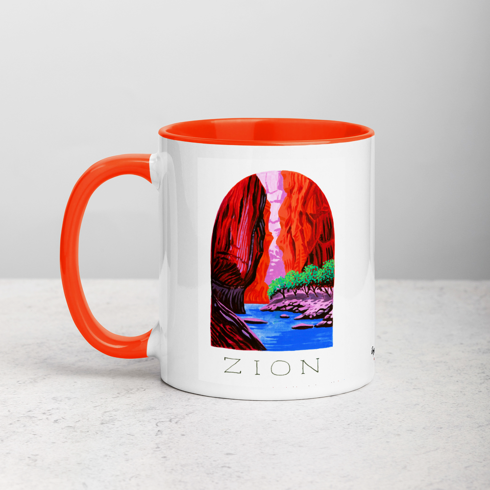White ceramic coffee mug with orange handle and inside; has Zion National Park illustration by Angela Staehling