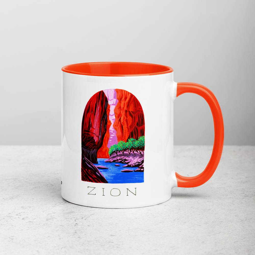 White ceramic coffee mug with orange handle and inside; has Zion National Park illustration by Angela Staehling