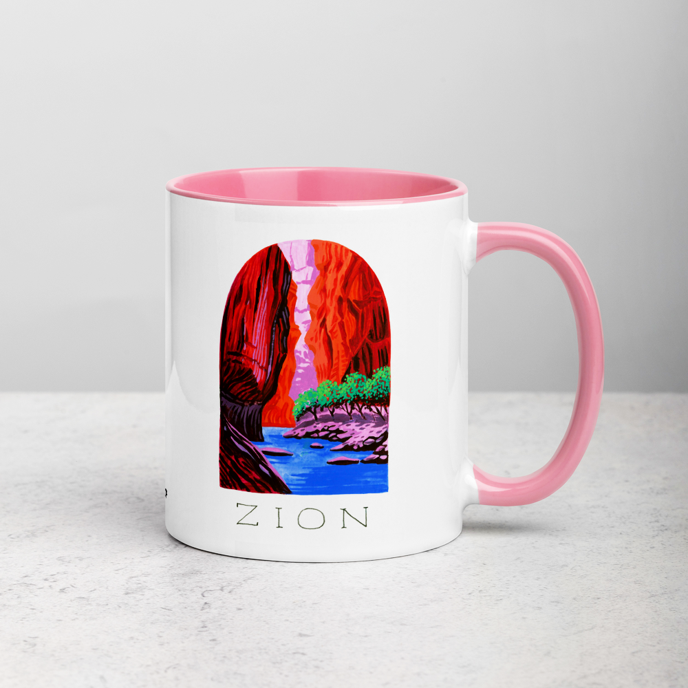 White ceramic coffee mug with pink handle and inside; has Zion National Park illustration by Angela Staehling